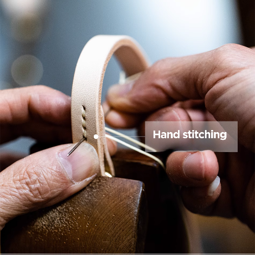 Craftsman Sewing the Leash: Witness the artistry of our craftsman as they skillfully sew each leash with precision and care, ensuring the highest quality and durability for your pet's walking accessory.