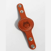 A brown Leather Airtag Chain featuring a printed Shiba cartoon design.