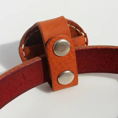 Back view of brown Leather Airtag Chain displaying details, including the button attachment.