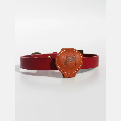Brown Leather Airtag Chain featuring a Shiba Inu cartoon print, installed on a red Smooth Calfskin Leather Buckle Cat Collar.